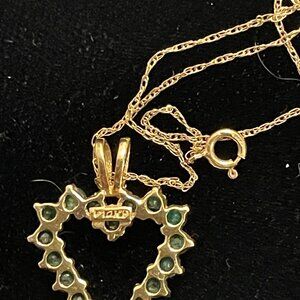 14 Karat Gold Heart Shaped Necklace With Many Small Emeralds